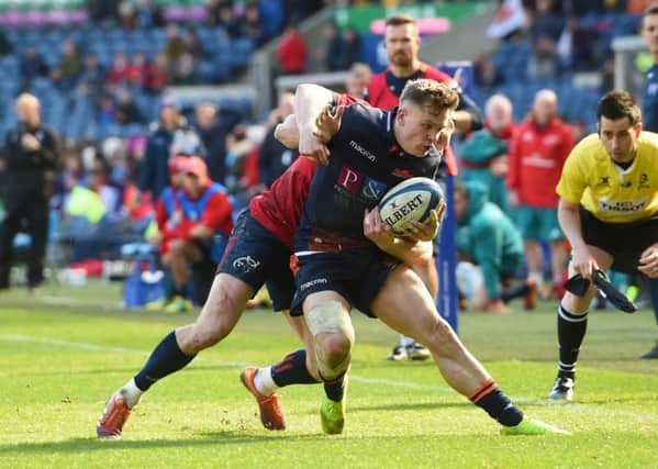 Darcy Graham tries to keep the ball in play during a fine performance as stand-in full-back for Edinburgh at Murrayfield on Saturday. Picture: SNS.