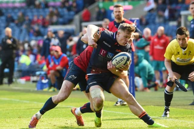 Darcy Graham tries to keep the ball in play during a fine performance as stand-in full-back for Edinburgh at Murrayfield on Saturday. Picture: SNS.