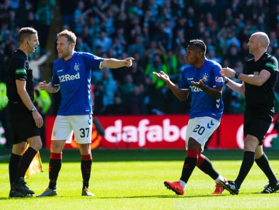 Alfredo Morelos argues against red card. Picture: SNS