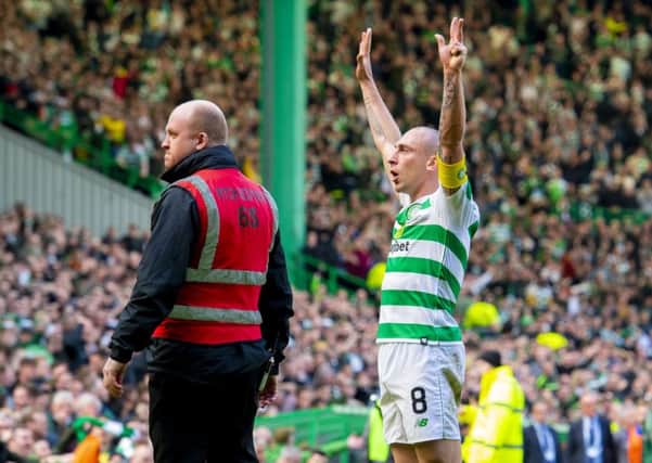 Scott Brown celebrates at full time as Celtic defeat Rangers 2-1 in the third Old Firm clash of the season. Picture: SNS Group
