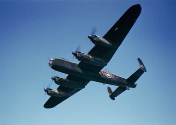 A Lancaster bomber pictured in flight in 1942 (Picture: Fox Photos/Hulton Archive/Getty Images)