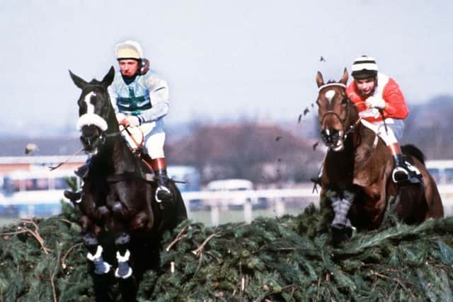 Rubstic, left,  leads at the final fence before winning the 1979 National.