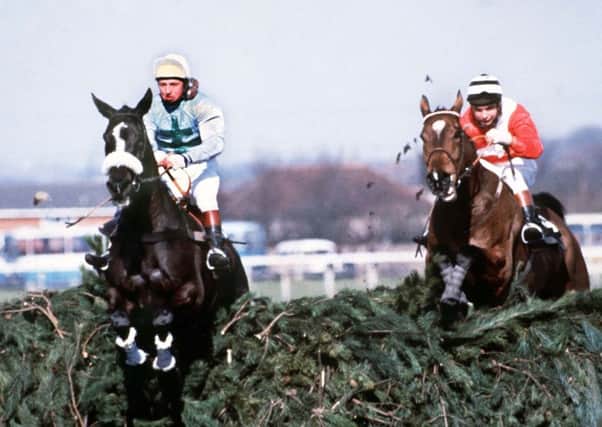 Rubstic, left,  leads at the final fence before winning the 1979 National.