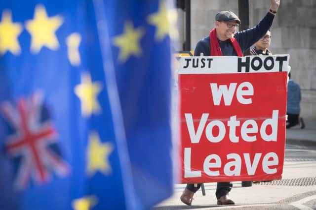 Leave and remain protesters outside the Houses of Parliament. Picture: Stefan Rousseau/PA Wire