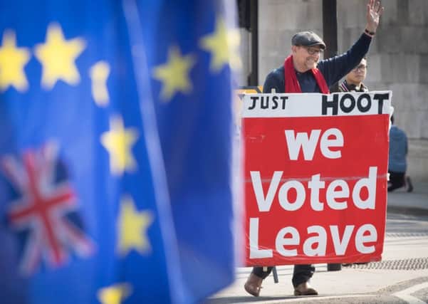Leave and remain protesters outside the Houses of Parliament. Picture: Stefan Rousseau/PA Wire