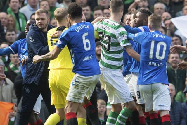 Celtic and Rangers players clash at full-time. Picture: SNS