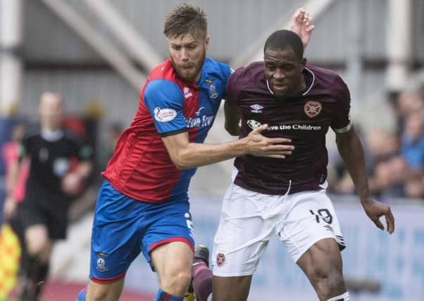 Uche Ikpeazu battles with Inverness' Shaun Rooney. Picture: SNS/Craig Foy