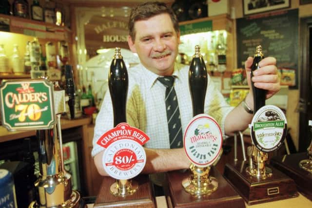 Halfway House Pub manager David Richer celebrates being included in the Good Beer Guide for the sixth year in a row in 1998.