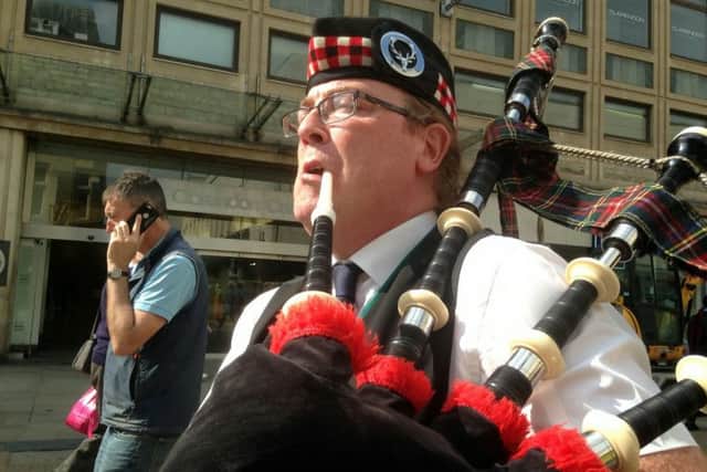 Busking bagpiper George Sinclair, 49, who is dividing opinion over his performances