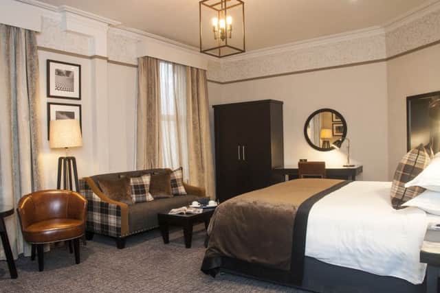 Onen of the newly refurbished rooms with its high ceilings and large windows