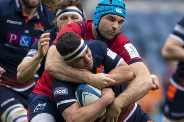 Munster's Tadhg Beirne gets to grips with
Edinburgh's Stuart McInally. Picture: Ross Parker/SNS