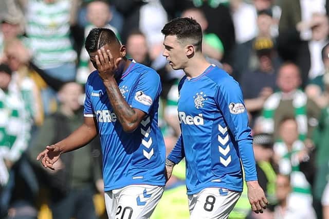 Rangers striker Alfredo Morelos, left, walks off the pitch after being red carded at Celtic Park. Picture: Ian MacNicol/Getty Images