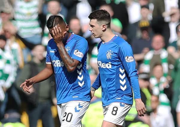 Rangers striker Alfredo Morelos, left, walks off the pitch after being red carded at Celtic Park. Picture: Ian MacNicol/Getty Images