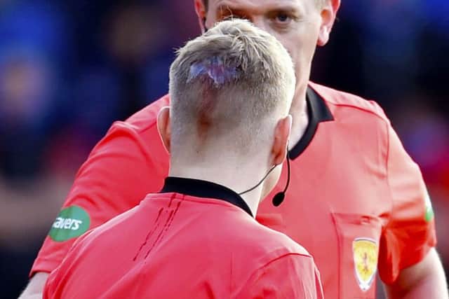Assistant referee Callum Spence needed stitches in a head wound after being struck by a coin. Picture: SNS Group