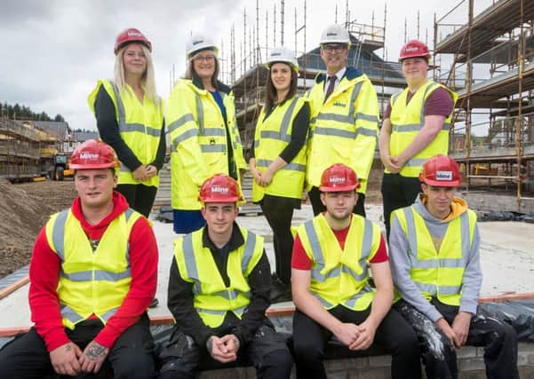 Stewart Milne Group HR director Karen Catto, resource manager Terrie Tully and construction and technical director Neil Thomson with the group's 2018 apprentices. Picture: Contributed