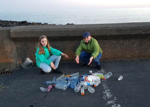 Visiting children find rubbish on Galloway beach. Apl 2019