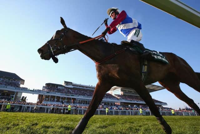 Jockey Derek Fox celebrates as he and One For Arthur cross the line to win the 2017 Randox Health Grand National
at Aintree. Picture: Alex Livesey/Getty