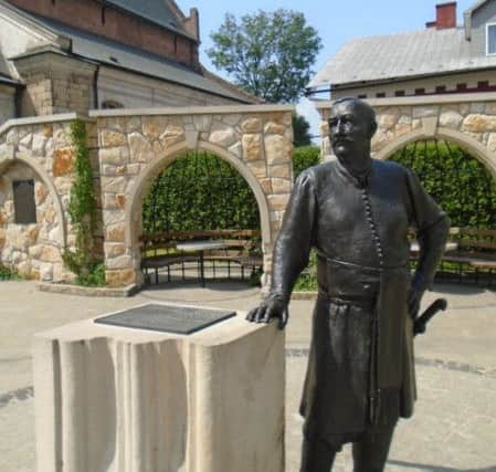 A statue of Robert Porteous outisde the church in Krosno he helped to  rebuild after it was destroyed by fire. PIC: Contributed.