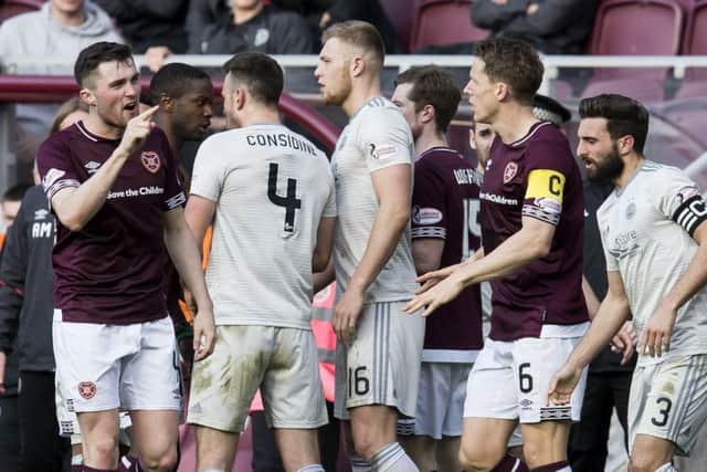 John Souttar exchanges words with the Aberdeen players during the confrontation. Picture: SNS Group