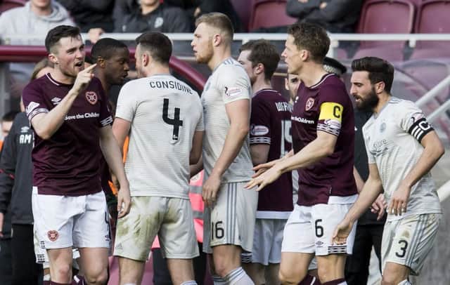 John Souttar exchanges words with the Aberdeen players during the confrontation. Picture: SNS Group