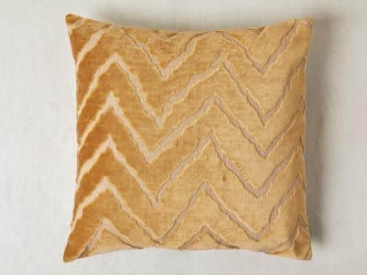 The 'velvet chevron' cushion is priced at 18 from Next (Photo: Next)