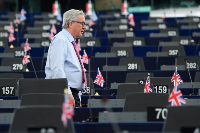 EU Commission president Jean-Claude Juncker walks through the Chamber before a debate on the conclusions of the last European Council. Picture: PATRICK HERTZOG/AFP/Getty Images
