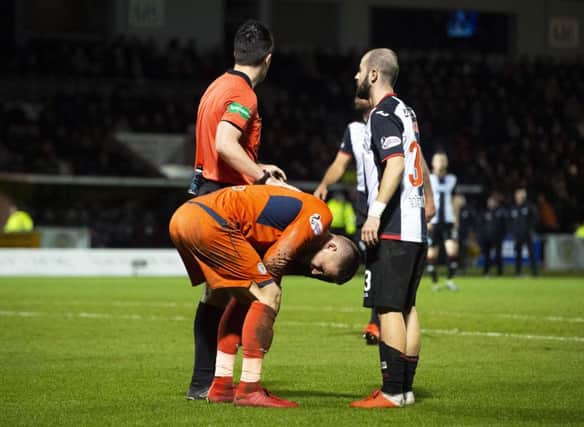 St Mirren's Vaclav Hladky was hurt after a firework was thrown near the goalkeeper during Wednesday night's match. Picture: SNS