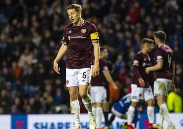 Hearts captain Christophe Berra dejected during loss at Ibrox. Picture: SNS/Alan Harvey