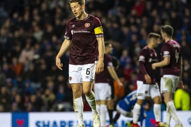 Hearts captain Christophe Berra dejected during loss at Ibrox. Picture: SNS/Alan Harvey