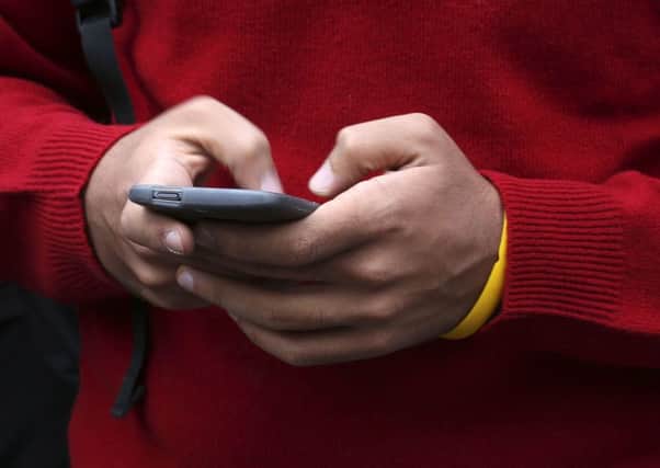 The rollout of technology allowing police to gather data from digital devices without using a password should be delayed, MSPs have said. Picture: Philip Toscano/PA Wire