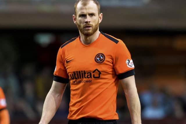 Mark Reynolds insists Dundee United cannot rely on Ross County slipping up in the race for top spot. Picture: SNS.
