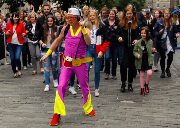Theresa May's latest outfit may be a bit garish but at least it encourages people to follow her