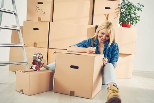 You can cut costs by roping in family or friends to help with packing for the move. Picture: PA