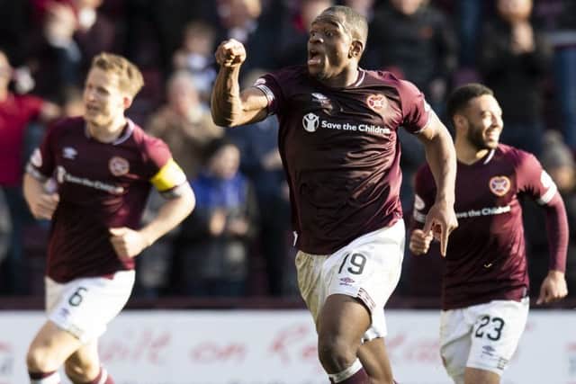 Uche Ikpeazu celebrates his goal against Aberdeen. Picture: SNS