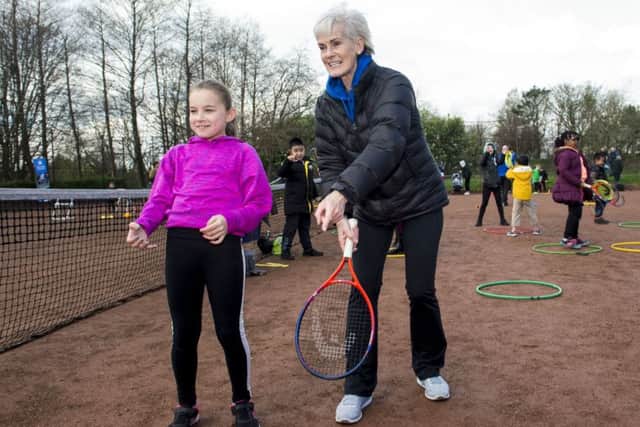 Judy Murray passes on some tips as she attends a family day at the courts in Maryhill Park. Picture: SNS.