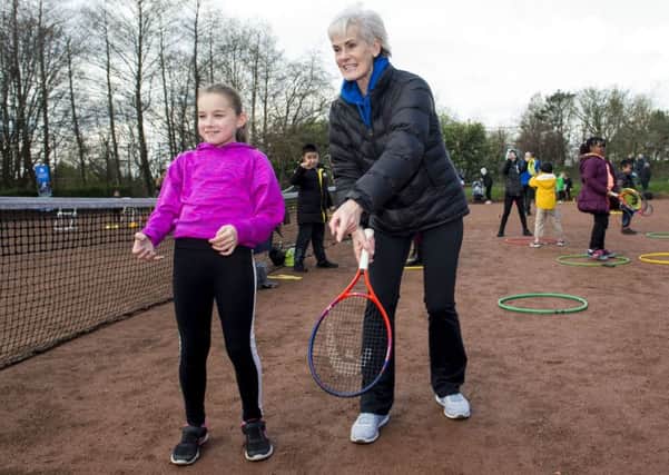 Judy Murray passes on some tips as she attends a family day at the courts in Maryhill Park. Picture: SNS.