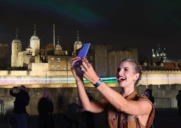 TVs Vogue Williams launches the latest Huawei phone at the London Lights installation last week. Picture: Getty