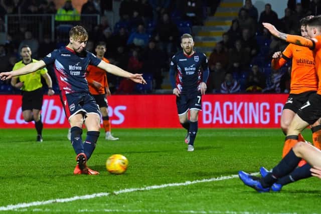 Ross Countys Jamie Lindsay scores his injury-time goal to snatch a draw  against Dundee United. Picture: SNS.