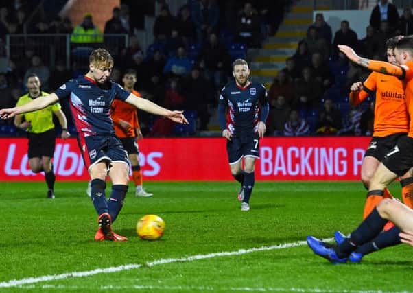 Ross Countys Jamie Lindsay scores his injury-time goal to snatch a draw  against Dundee United. Picture: SNS.
