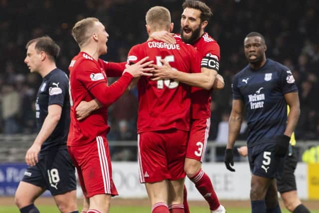 Aberdeen's Sam Cosgrove celebrates with Graeme Shinnie and Lewis Ferguson. Pic: SNS/Ross Parker