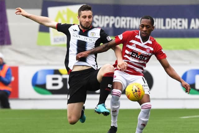 Hamilton's Mickel Miller and St Mirren's Mateo Muzek battle for the ball. Pic: SNS/Paul Devlin