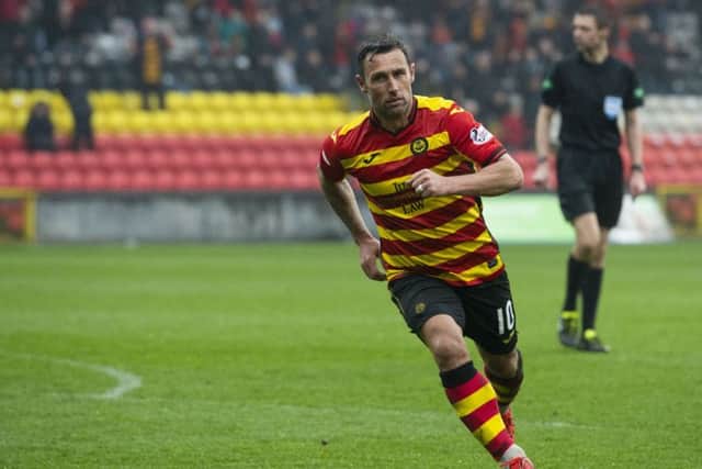 Partick Thistle's Scott McDonald celebrates his goal to makee it 2-2. Pic: SNS/Sammy Turner