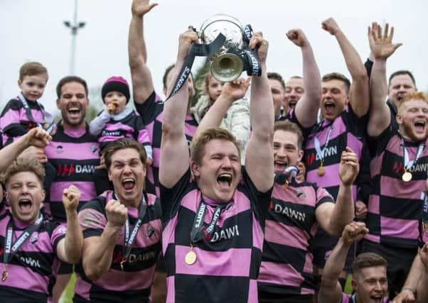 Skipper Pete McCallum leads the trophy celebrations for Ayr. Picture: SNS/SRU