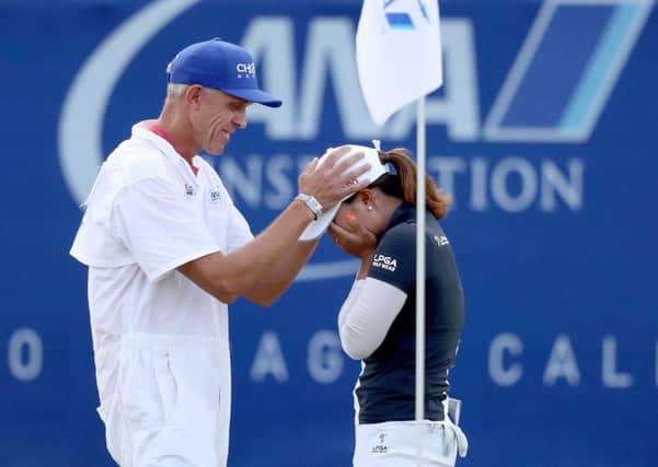 Jin Young Ko of Korea is congratulated by her caddie David Brooker after holing out to win the ANA Inspiration. Picture: Matthew Stockman/Getty