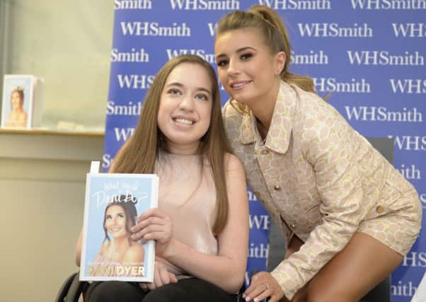 Dani Dyer, with fan Maya Coates, 18, from Edinburgh, in the St Enochs Centre. Picture: SWNS