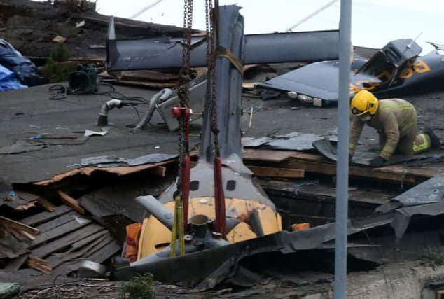 The wreckage of the police helicopter at the Clutha Bar in Glaasgow. Picture: Andrew Milligan/PA.