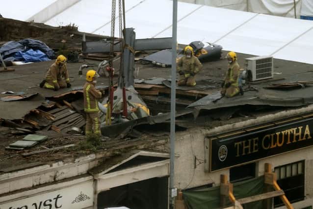 The wreckage of the police three-tonne Eurocopter before being lifted from the Clutha Vaults in Glasgow following the crash which killed at least nine people.