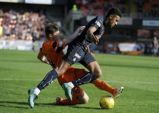 About 100,000 people turn out to watch football games like Dundee United vs Falkirk every weekend (Picture: Michael Gillen)