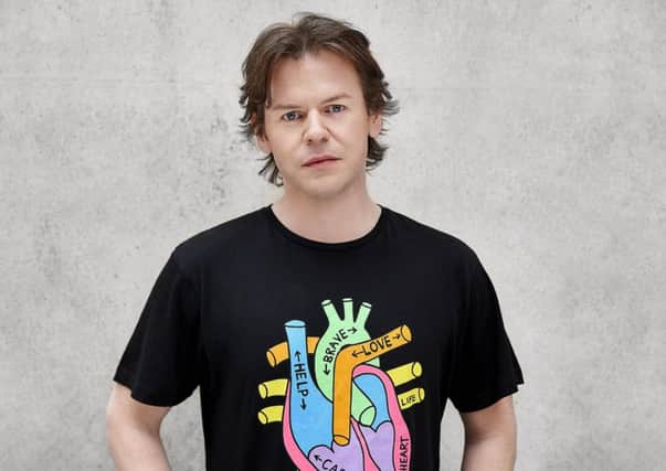 Christopher Kane wears one of his exclusive design Heart of Scotland Appeal T-shirts