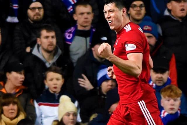 Aberdeen's Scott McKenna celebrates after scoring against Rangers at Ibrox. Picture: SNS